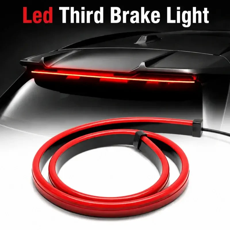 Red LED third brake light strip for car rear window, enhancing safety and style